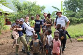 WVUEWB members visited with locals while volunteering in the village of Kabughabugha.