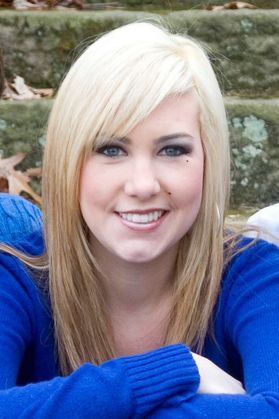 Headshot of Lindsay Gardner, granddaughter of WVU donor Margaret Workman. She is pictured outside wearing a royal blue sweater and she has long blonde hair. 