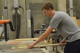 Byron Utley works on a stage set in the WVU College of Creative Arts technology and design department.