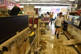 WVU students volunteer to help flooded businesses in wake of 2016 flood.