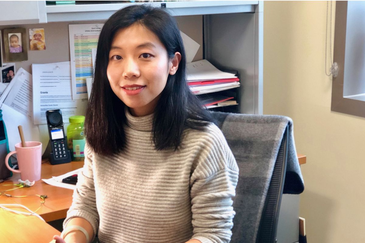 Photo of Shan Jiang, assistant professor of landscape architecture in the School of Design and Community Development in her office