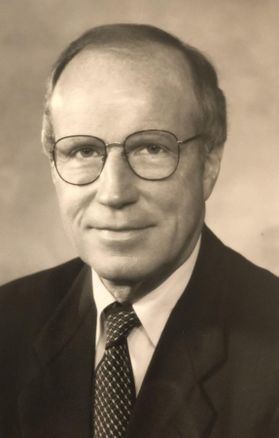 man in glasses, suit and tie
