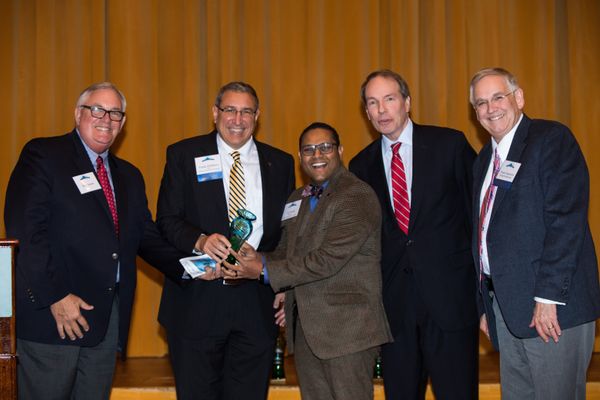 Rod Stoner, retired hotel executive; Frank DeMarco and Dr. Ajay Aluri, who head the program at the WVU College of Business and Economics; Tom Heywood, master of ceremonies for the awards event; and Frank Jorgensen, WVHTA chairman at the 8th Annual Hospitality University conference. 