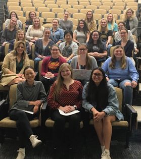 photo of group of women in large lecture hall