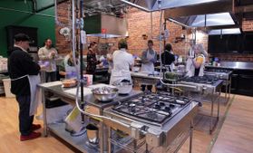 People cooking in a commercial kitchen