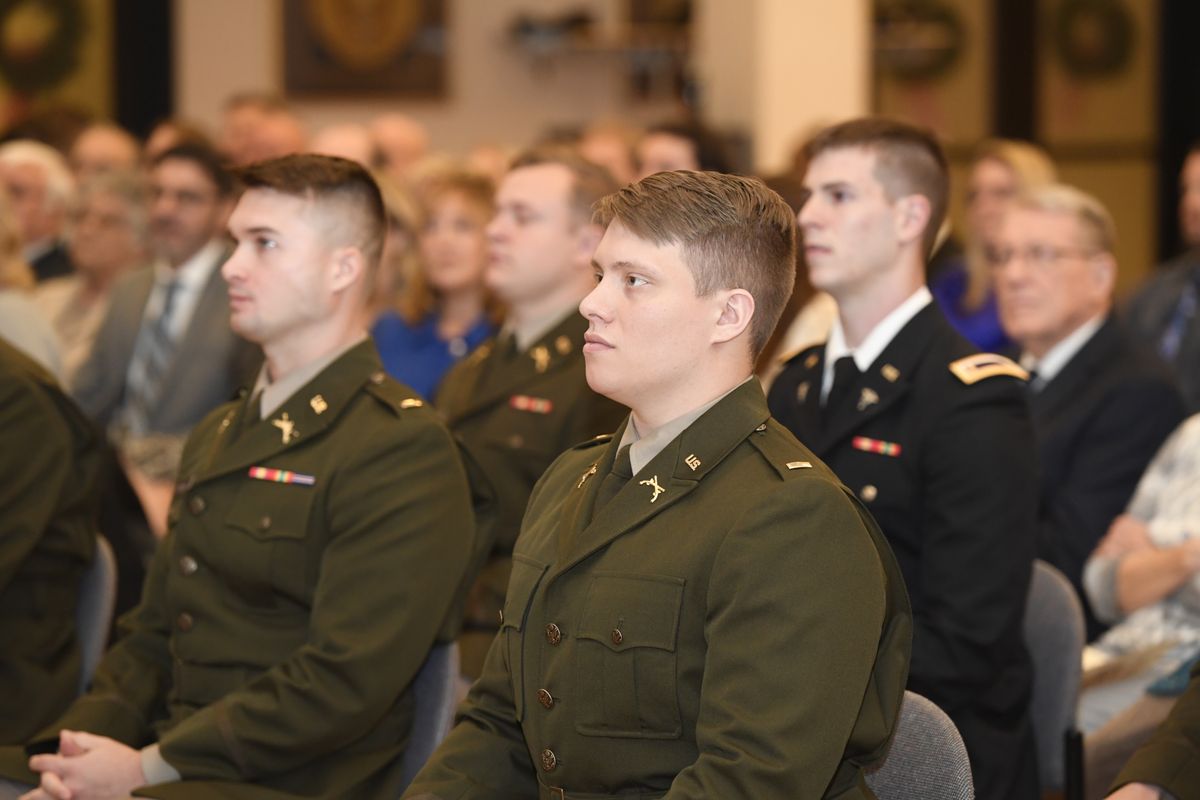 ROTC members sit in the audience during a commissioning ceremony. 