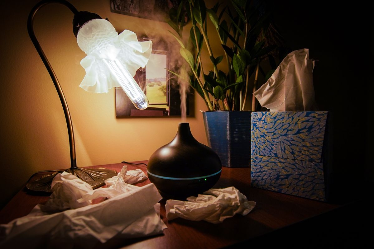 photo of diffuser in low light, box of tissues