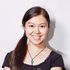 Headshot of WVU researcher Xi Yu. She is standing in front of a light background wearing a black shirt with a beaded necklace. She has long black hair. 