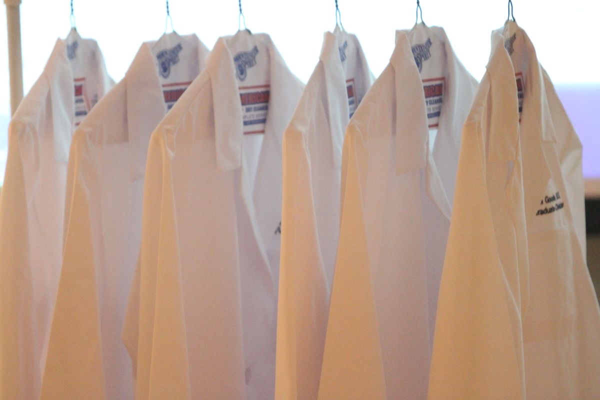 white coats on hangers. 