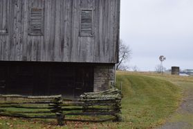 Old barn with a wooden fence
