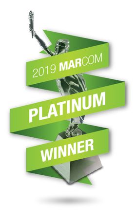 A green ribbon reading "2019 MArCom Platinum Winner"