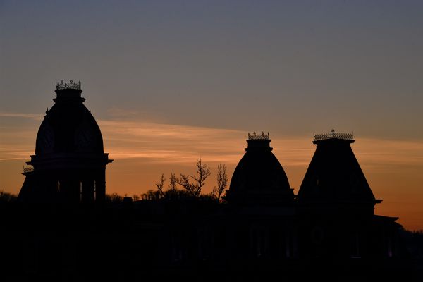 silhouettes of turrets in the sunset