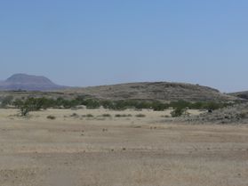 photo of grasslands with low hills rising in the background