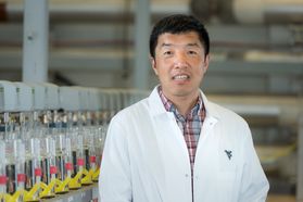 Photo of Xingbo Liu in a lab coat