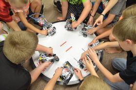 students play with robots 
