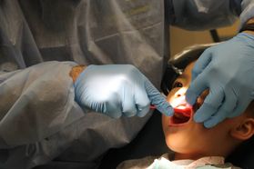 A child receives dental care. (WVU Photo)