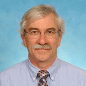 Smiling man with glasses and mustache