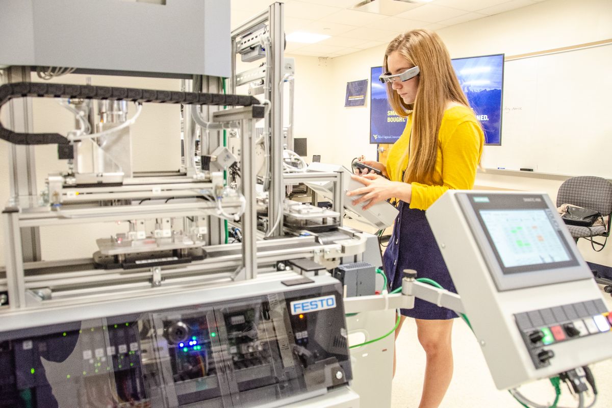 woman in lab wearing goggles