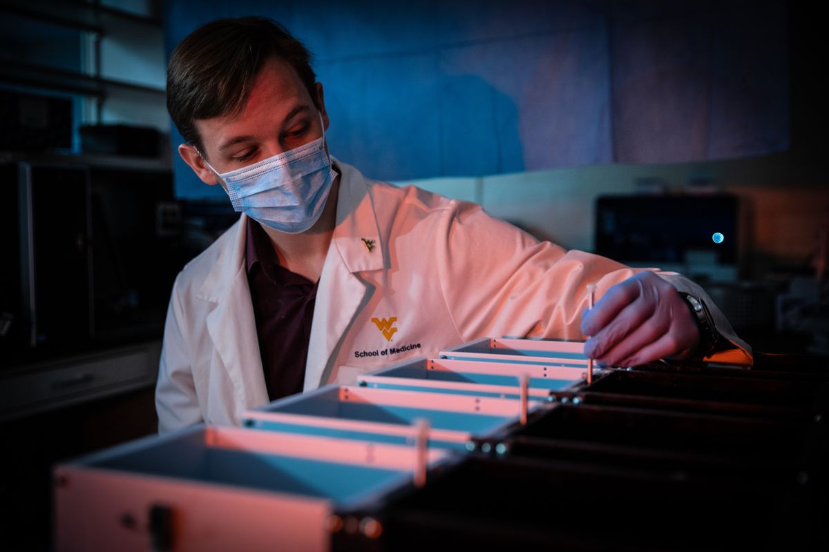 man in medical mask in lab