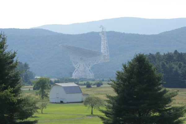 A large satellite telescope in a field 