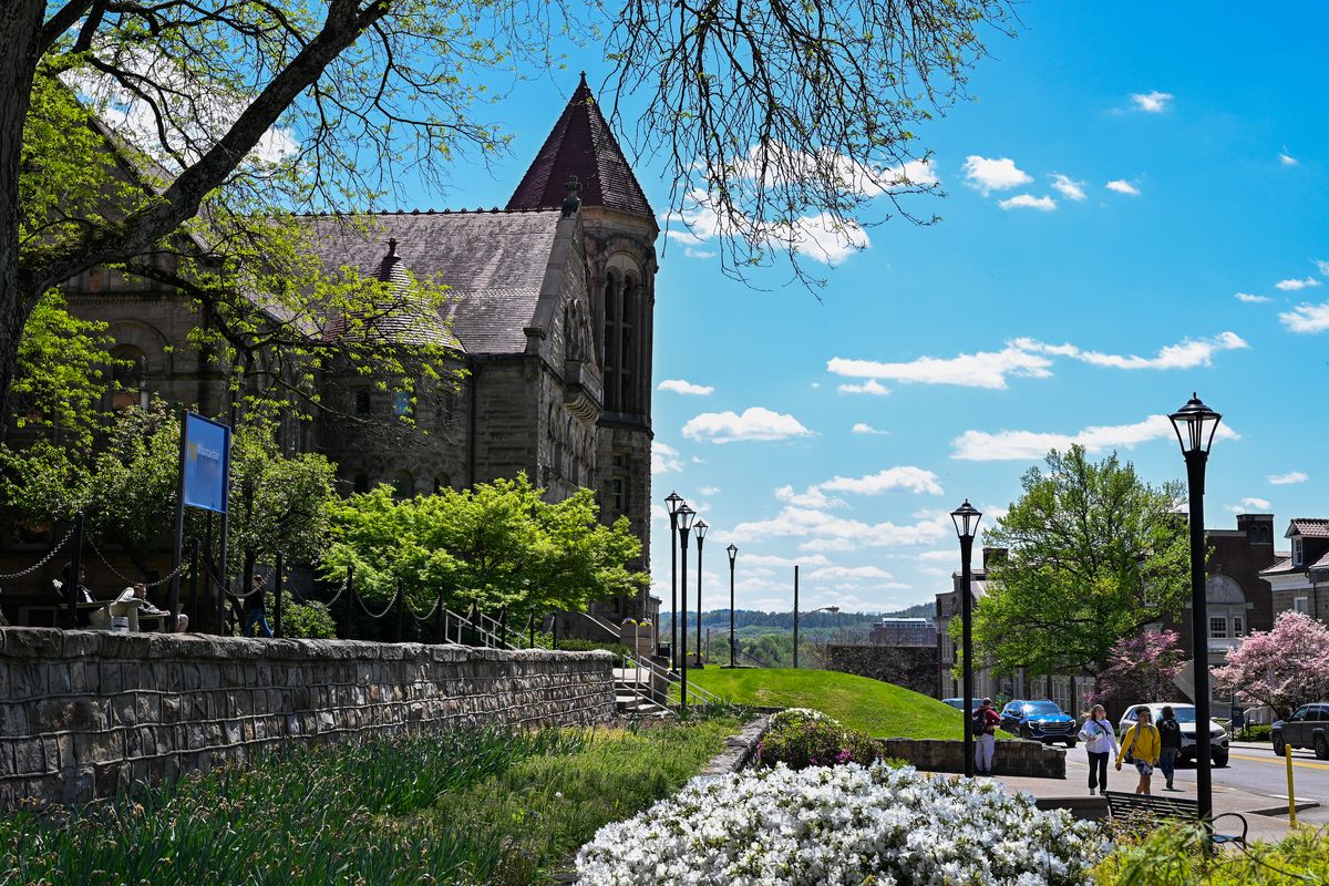 Stewart Hall is shown under blue skies on a spring day in Morgantown.