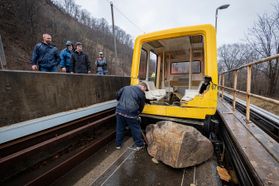 WVU personnel work on the PRT tracks after a rock slide Monday, Feb. 10, 2020. To safely remove people from the PRT vehicle, emergency officials needed to remove a large portion of the vehicle.