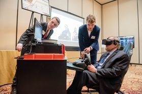 Three men use VR technology
