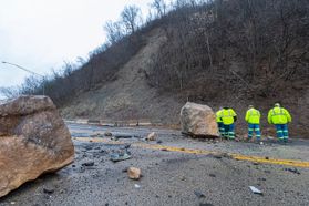 emergency personnel inspect large boulders after a rock slide Monday, Feb. 10, 2020 in Morgantown.