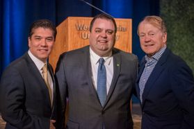 WVU John Chambers College of Business and Economics Dean Javier Reyes (L) with Huntington regional president for West Virginia Chad Prather (C) and WVU alumnus John Chambers.