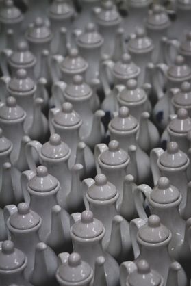 Picture of tea kettles in rows