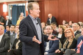 Photo of John Chambers in front of a crowd