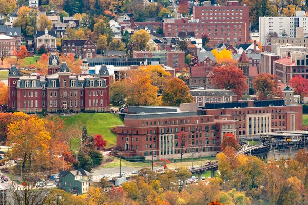 The Downtown Campus, including Woodburn Hall and Hodges Hall, are shown surrounded by fall colors.