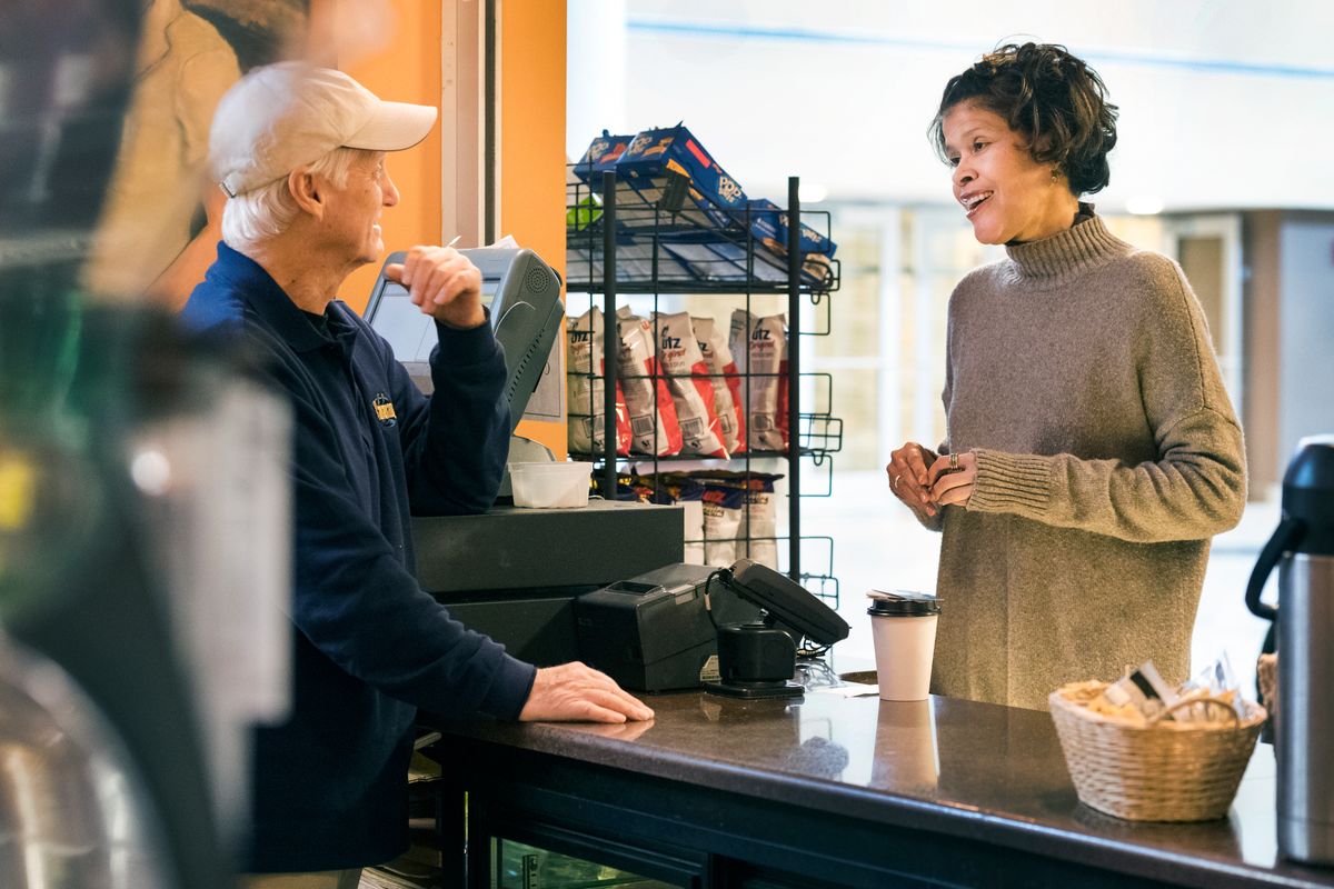 Lauri Andress (right), an assistant professor in the WVU School of Public Health, studies rural residents’ access to healthy food. Shown here during a visit to Cavanaugh’s coffee shop, at the Robert C. Byrd Health Sciences Center, Andress is interested in infrastructure investments, economic development and employment opportunities that can improve food access for the rural elderly.