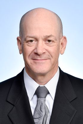 balding man with suit coat, gray tie, white shirt