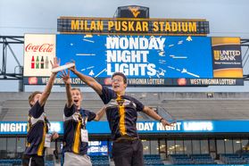 Students play Frisbee on Mountaineer Field