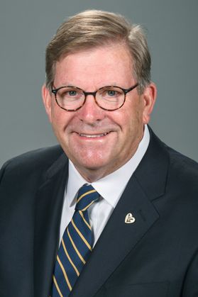Man wearing a suit and glasses