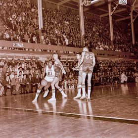 black and white photo of a basketball game