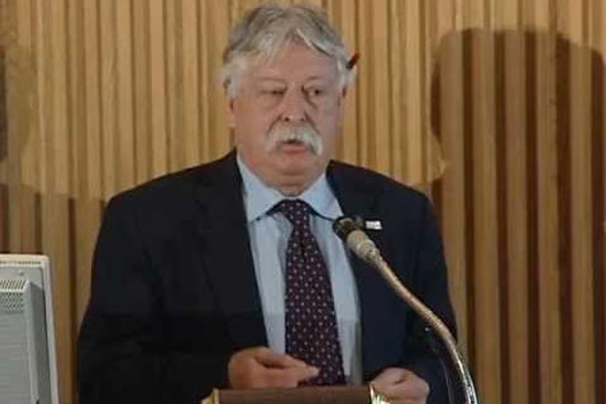 Photo of William Beezley at a microphone