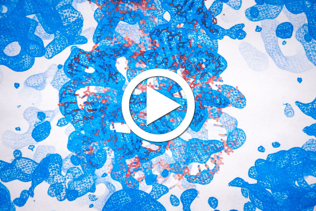 mass of blue splotches and splatters with play button in center