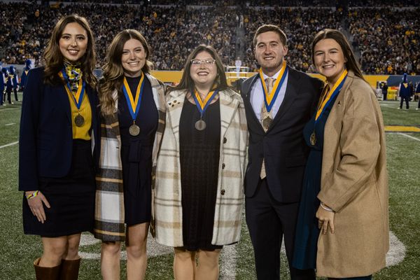 The five 2023 Mountaineers of Distinction are shown on Mountaineer Field.