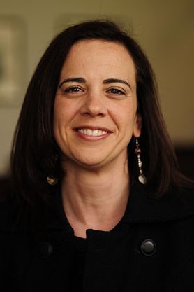 photo of smiling dark haired woman