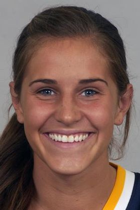 Headshot of WVU women's standout great Meg Bulger. She is pictured against a white background with her hair tied back in a pony tail with a sliver of the a sports jersey neckline showing in the frame. 