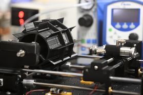 A closeup shot of a 3D printer custom designed by WVU researchers.