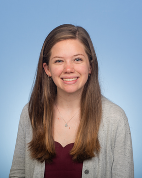 Headshot of WVU researcher Katherine Lee. She has long blonde hair and is wearing a maroon top with a tan cardigan. 