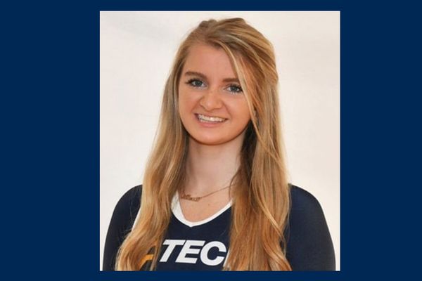 Headshot of WVU Tech alumna Alexis Zilinkski wearing a WVU Tech V-neck shirt. She has long, blond hair pulled up on the sides. Her headshot is placed on a blue background. 