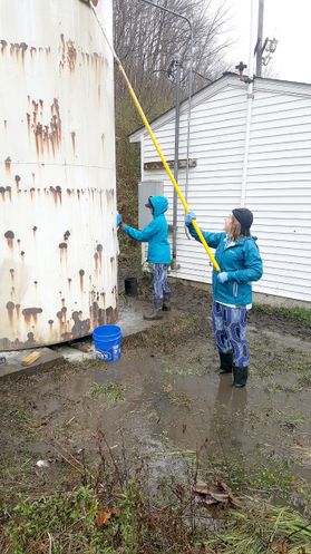 Rain from a recent storm forced the students to work in nearly knee-deep water.