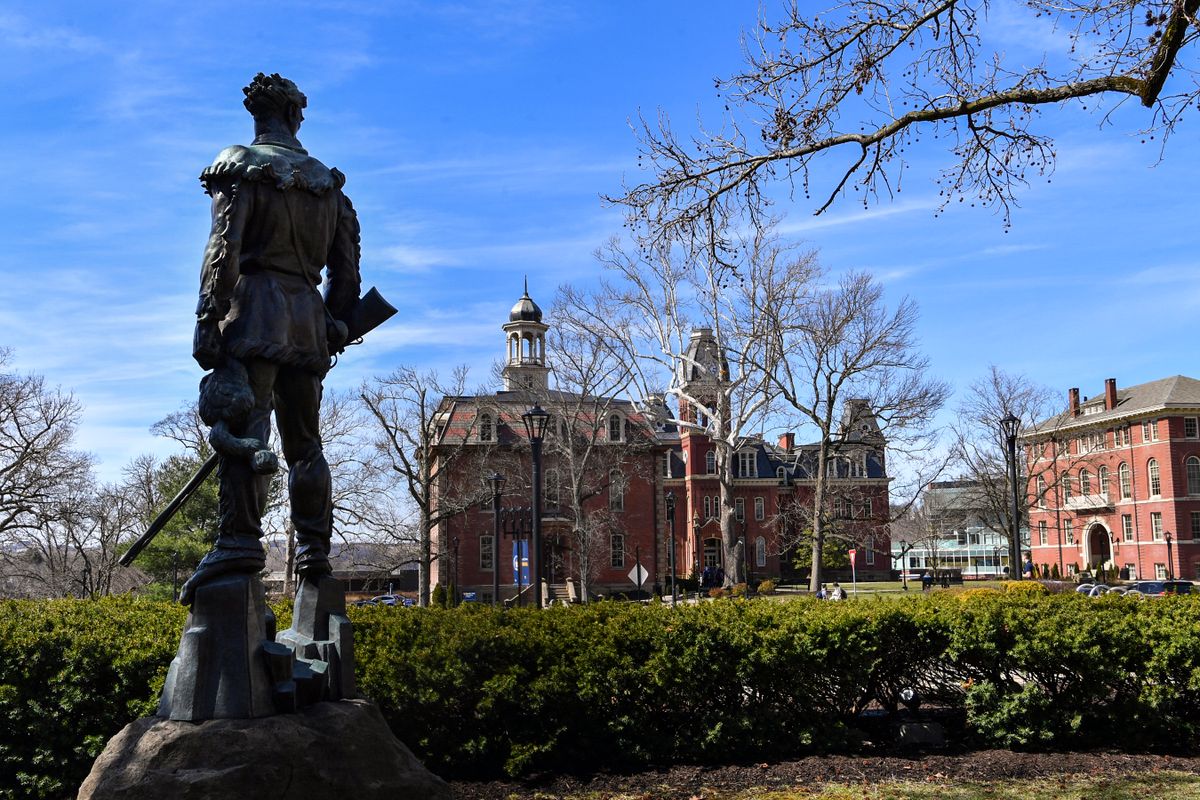 Mountaineer man statue looks out to Woodburn Circle
