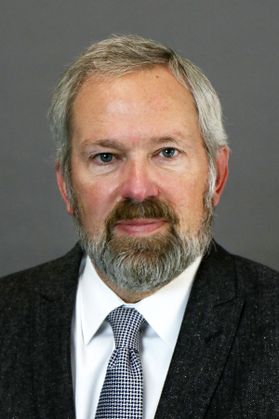 Man with grey hair and beard