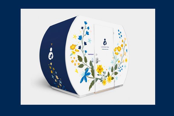 This is the exterior of a lactation pod available to parents at the WVU Coliseum. The pod is round on the sides and flat on the top and bottom with gold and blue flowers on the front where an access door is located.