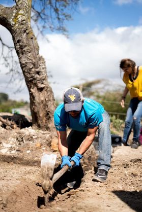 A WVU student digs a ditch in Nicaragua as part of the Global Brigade.